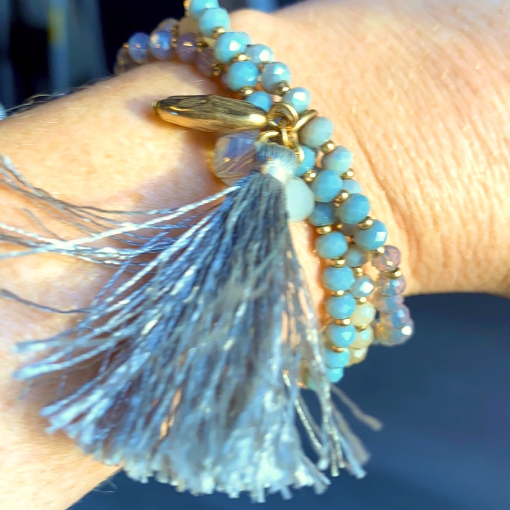 Cute little beaded bracelet with a tassel abs gold accents